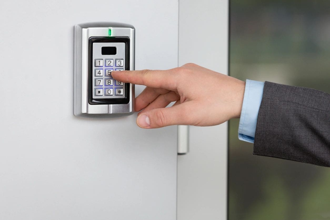 A person is using the electronic key to open a door.