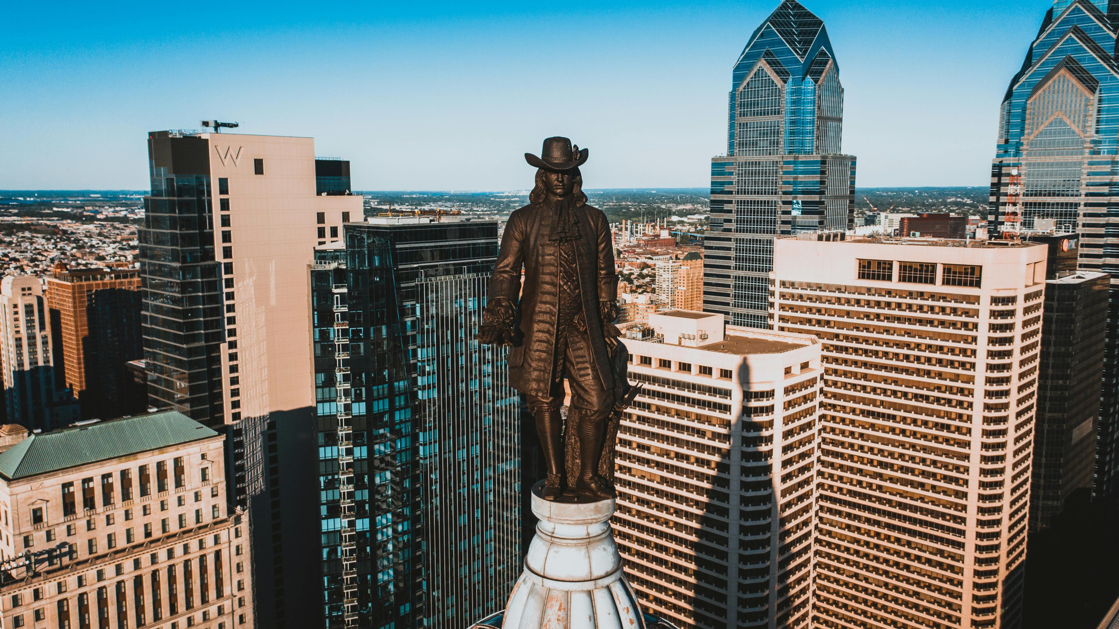 A statue of a man on top of a building.