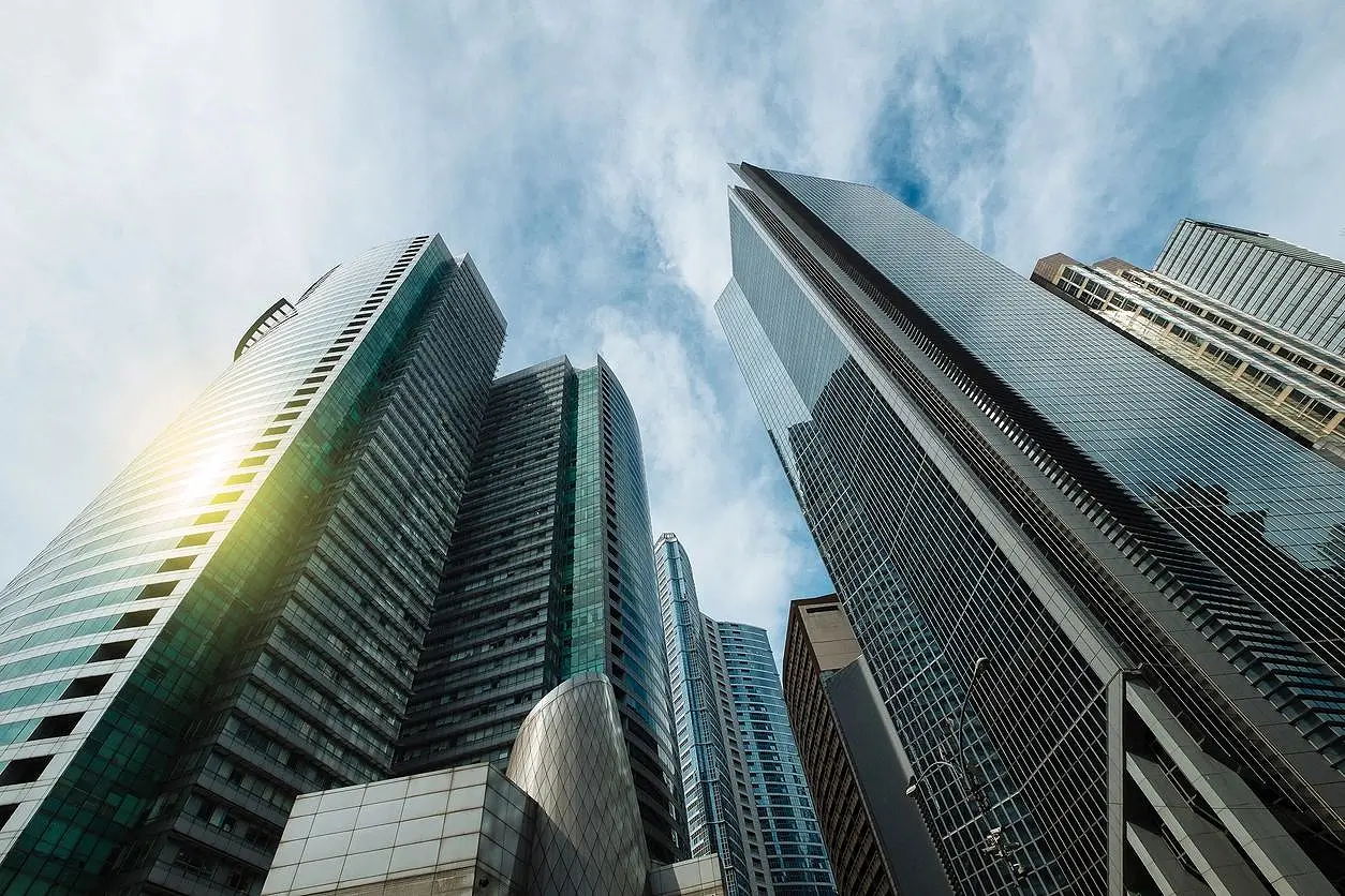 A view of some skyscrapers from below the ground.